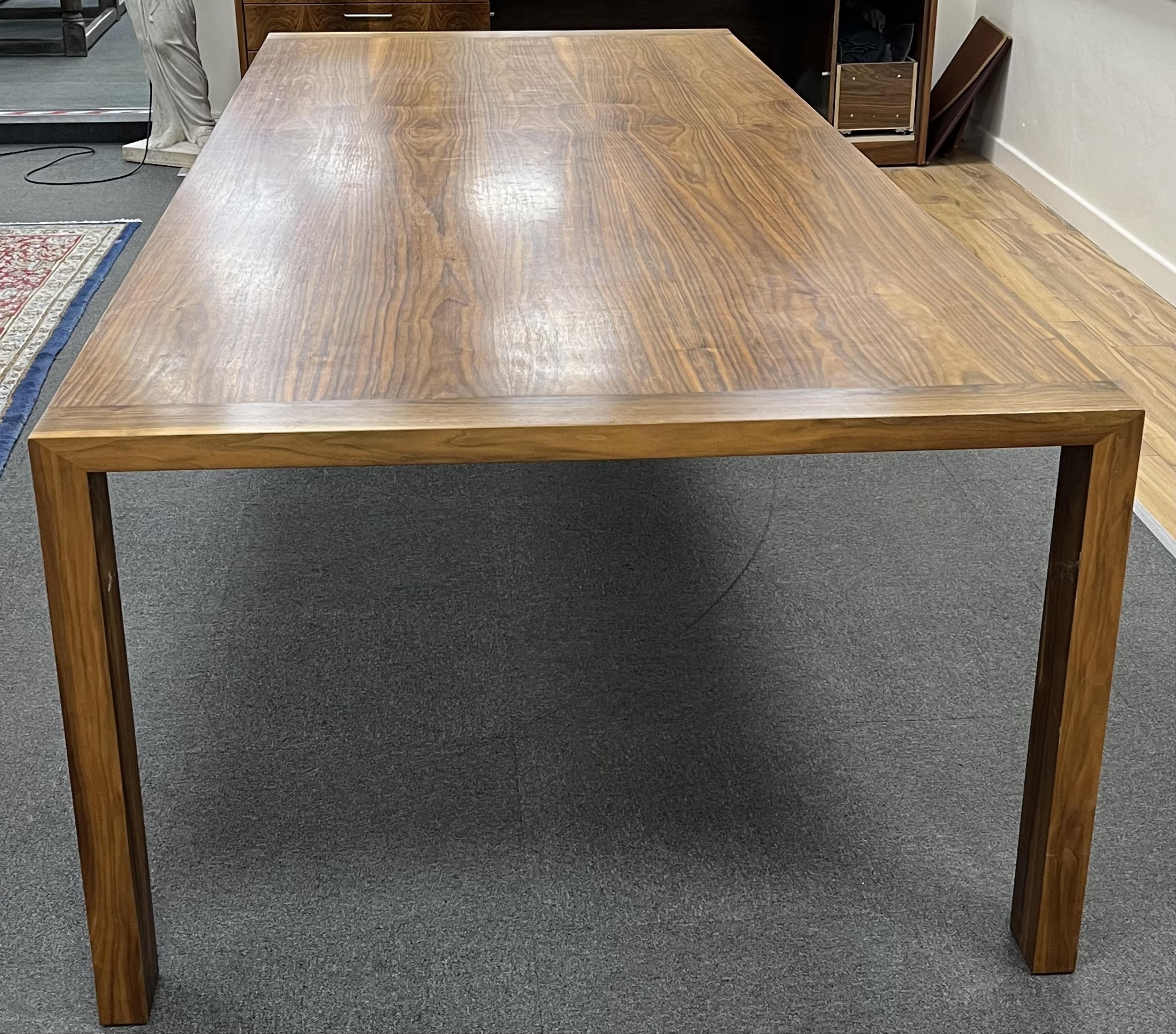 A Contemporary American black walnut dining table and ten chairs, by Chartwood designs Ltd, width 300cm, depth 120cm, height 75cm. Condition - fair